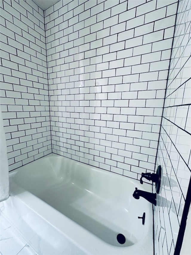 full bath featuring shower / washtub combination