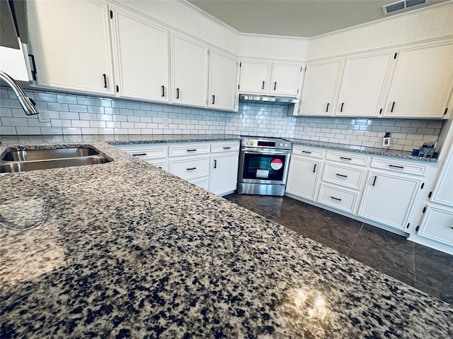 kitchen featuring stainless steel range with electric stovetop, white cabinetry, light stone counters, and a sink