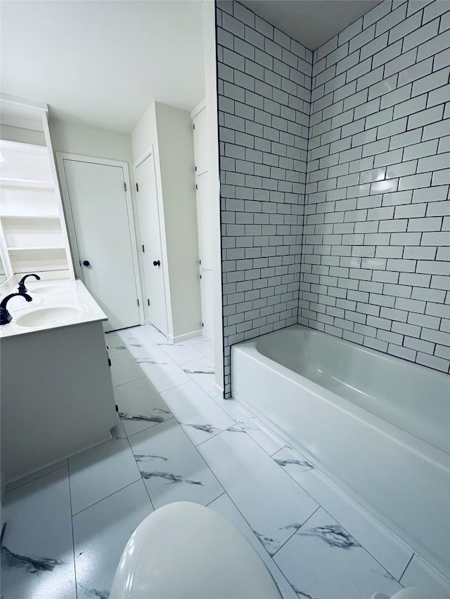 full bath featuring shower / washtub combination, marble finish floor, a sink, and double vanity