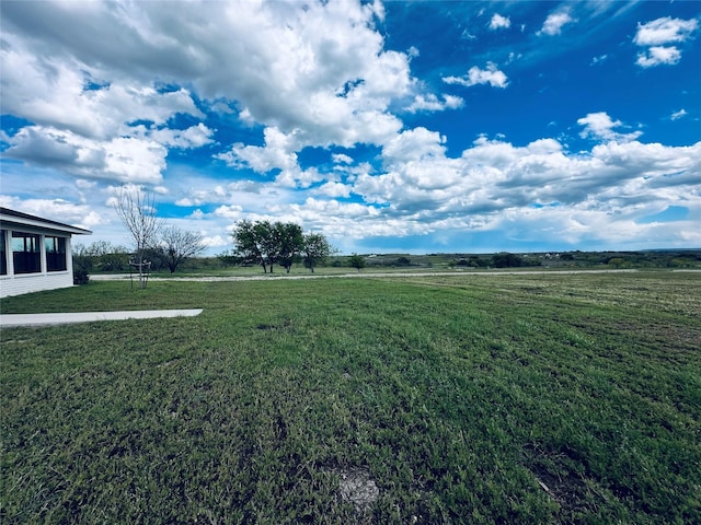 view of yard with a rural view