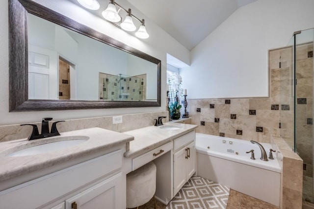 full bath with lofted ceiling, a stall shower, and a sink