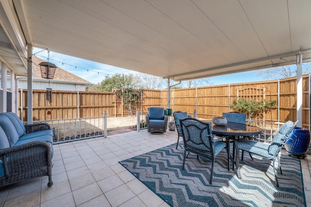 view of patio / terrace featuring outdoor dining space, a fenced backyard, and an outdoor hangout area