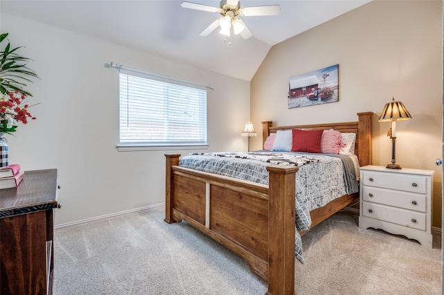 carpeted bedroom with lofted ceiling, baseboards, and ceiling fan