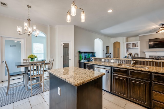 kitchen with visible vents, a sink, dishwasher, open floor plan, and a center island