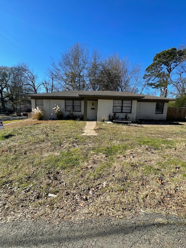 view of front of property with a front lawn