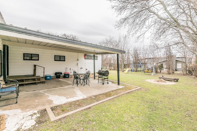 view of yard featuring a patio and a playground