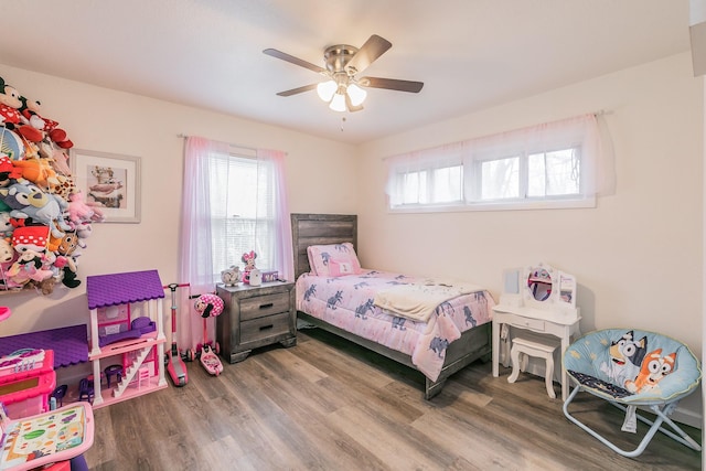 bedroom featuring wood finished floors and a ceiling fan