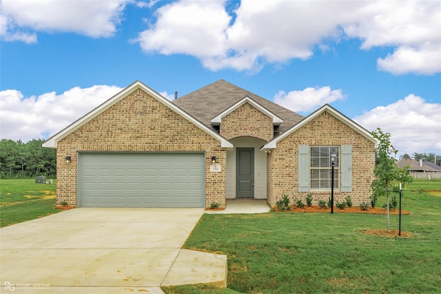 ranch-style house with driveway, a garage, a shingled roof, a front lawn, and brick siding