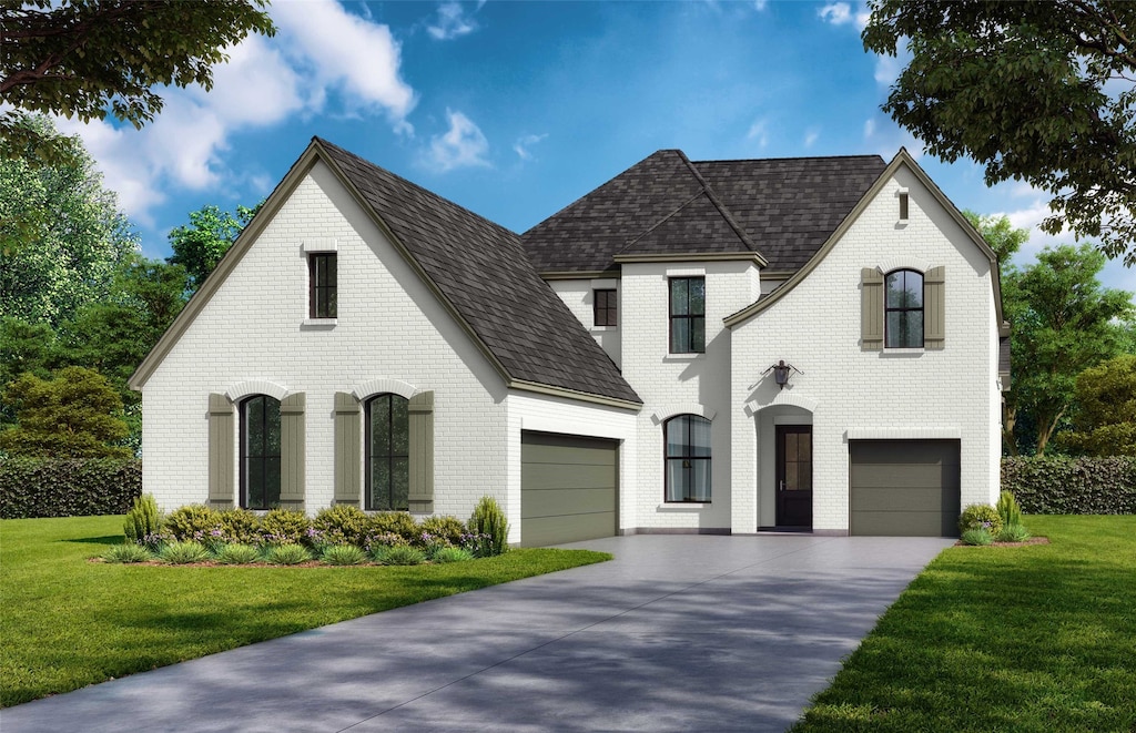 french country style house with a garage, brick siding, a shingled roof, concrete driveway, and a front yard
