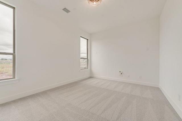 3206 Bexar St, Rockwall, TX 75032 - spare room with light colored carpet and baseboards