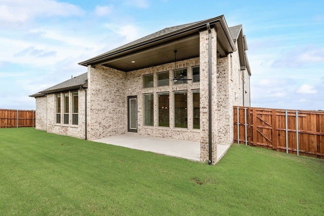 3206 Bexar St, Rockwall, TX 75032 - back of property with a fenced backyard, brick siding, a patio, and roof with shingles