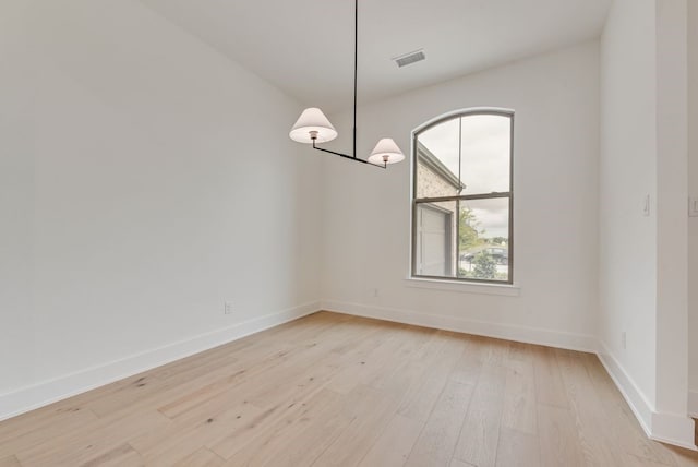 3206 Bexar St, Rockwall, TX 75032 - spare room with light wood-type flooring and baseboards