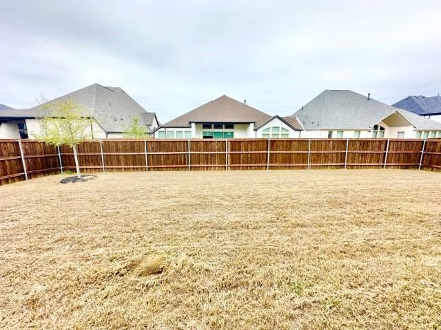 view of yard featuring a fenced backyard