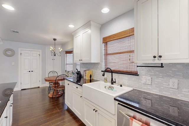 1001 British Blvd, Grand Prairie, TX 75050 - kitchen featuring visible vents, a sink, dark wood-style floors, white cabinetry, and an inviting chandelier