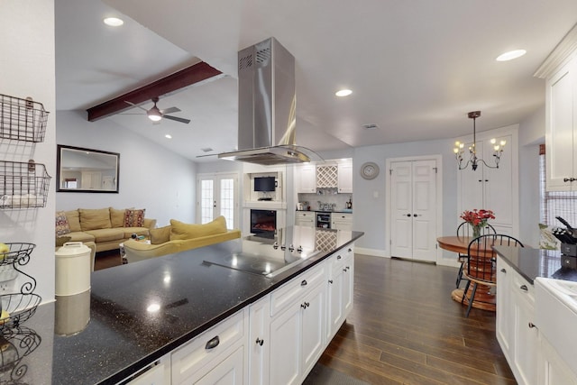 1001 British Blvd, Grand Prairie, TX 75050 - kitchen with ceiling fan with notable chandelier, lofted ceiling with beams, dark wood-style floors, island range hood, and black electric stovetop