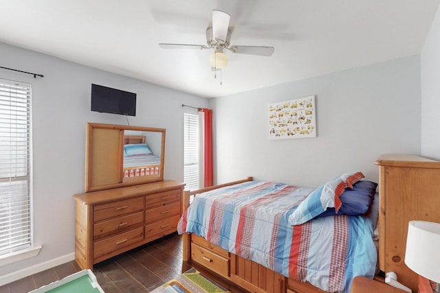 1001 British Blvd, Grand Prairie, TX 75050 - bedroom featuring a ceiling fan, dark wood-style flooring, and baseboards