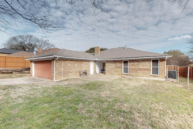 1001 British Blvd, Grand Prairie, TX 75050 - back of house featuring a lawn, fence, a garage, brick siding, and a chimney