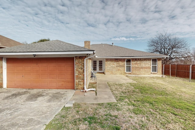 1001 British Blvd, Grand Prairie, TX 75050 - view of front of home featuring fence, a chimney, a front lawn, french doors, and brick siding