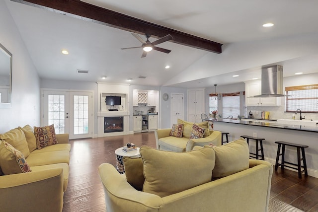 1001 British Blvd, Grand Prairie, TX 75050 - living area with visible vents, a healthy amount of sunlight, vaulted ceiling with beams, and dark wood-type flooring