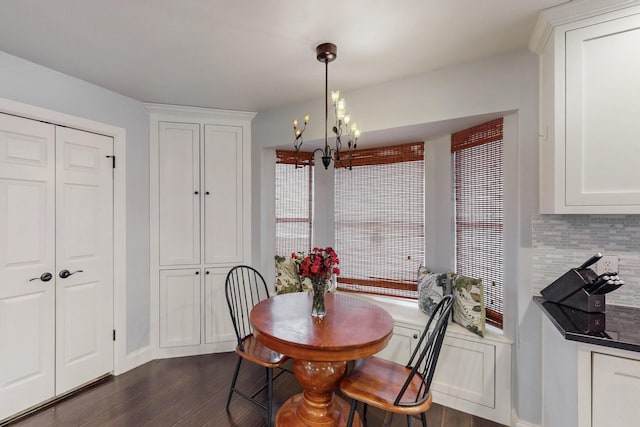 1001 British Blvd, Grand Prairie, TX 75050 - dining room featuring baseboards, dark wood-type flooring, and an inviting chandelier