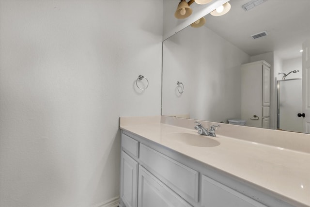 1520 Bagby Ave, Waco, TX 76706 - bathroom with vanity, a shower with door, and toilet