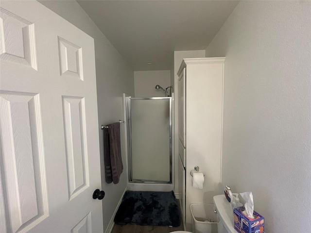 1520 Bagby Ave, Waco, TX 76706 - bathroom with a stall shower, toilet, and baseboards