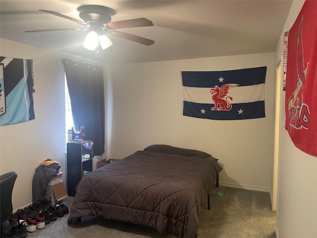 carpeted bedroom with a ceiling fan and baseboards