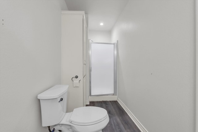 1520 Bagby Ave, Waco, TX 76706 - full bathroom featuring a shower stall, wood finished floors, toilet, baseboards, and recessed lighting