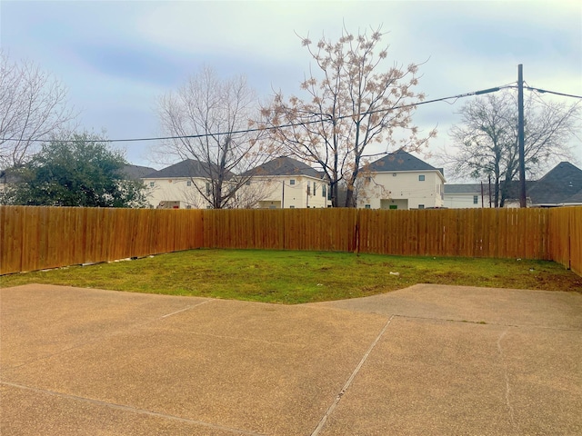 view of yard with a patio area and a fenced backyard