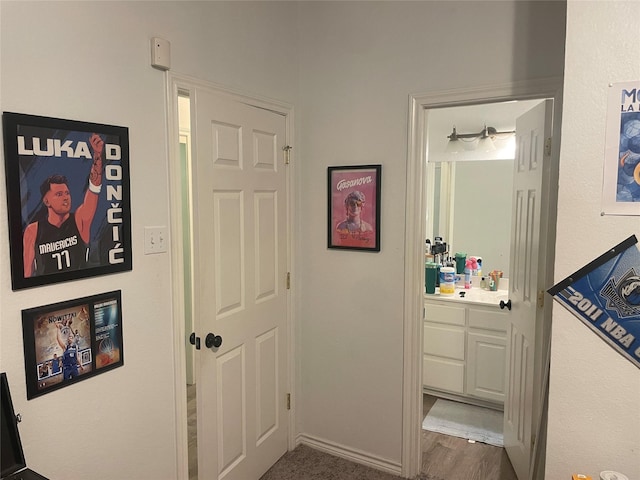 hallway featuring dark wood-style flooring