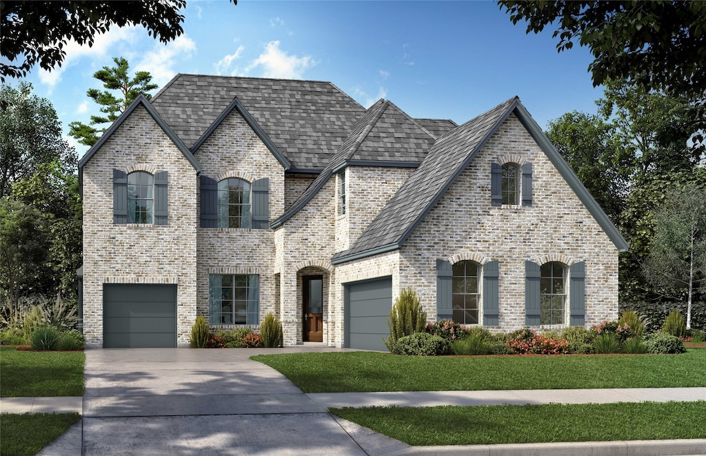 french country style house with concrete driveway, brick siding, and a front lawn