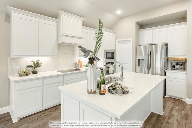 kitchen with black appliances, an island with sink, light countertops, and white cabinets