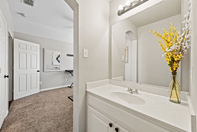 bathroom featuring visible vents and vanity