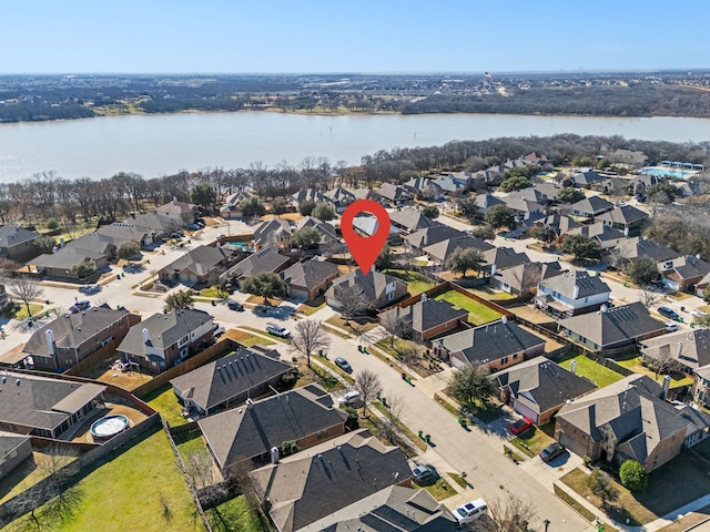 bird's eye view with a water view and a residential view