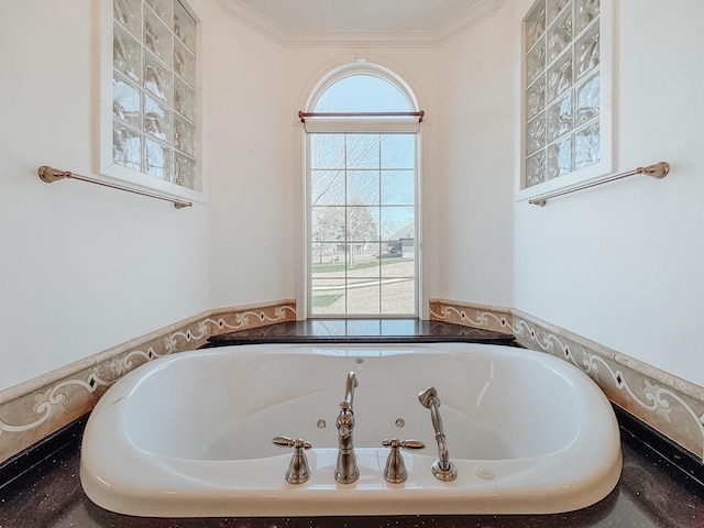 bathroom with walk in shower and a healthy amount of sunlight