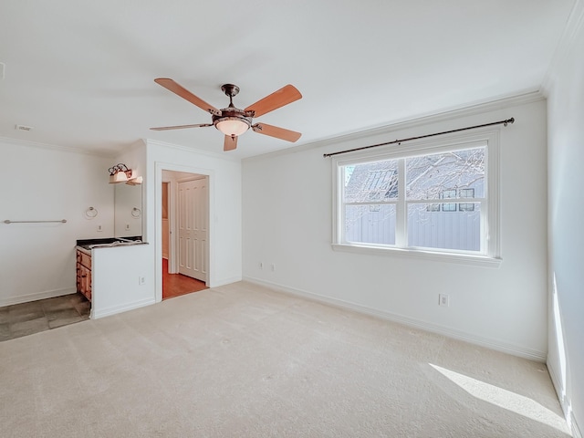 additional living space with lofted ceiling, a wainscoted wall, a ceiling fan, a decorative wall, and light wood-style flooring