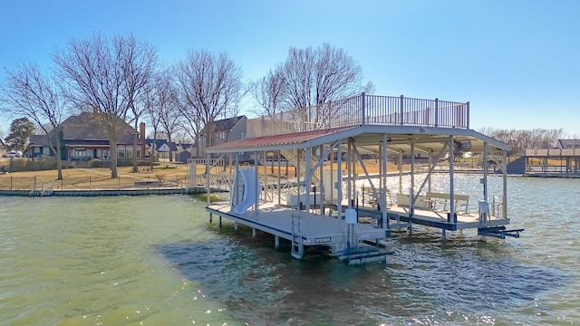 view of dock featuring a water view and boat lift