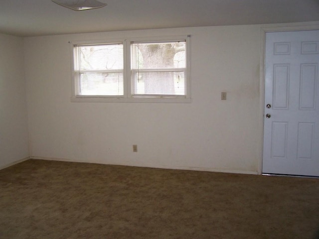 spare room featuring carpet