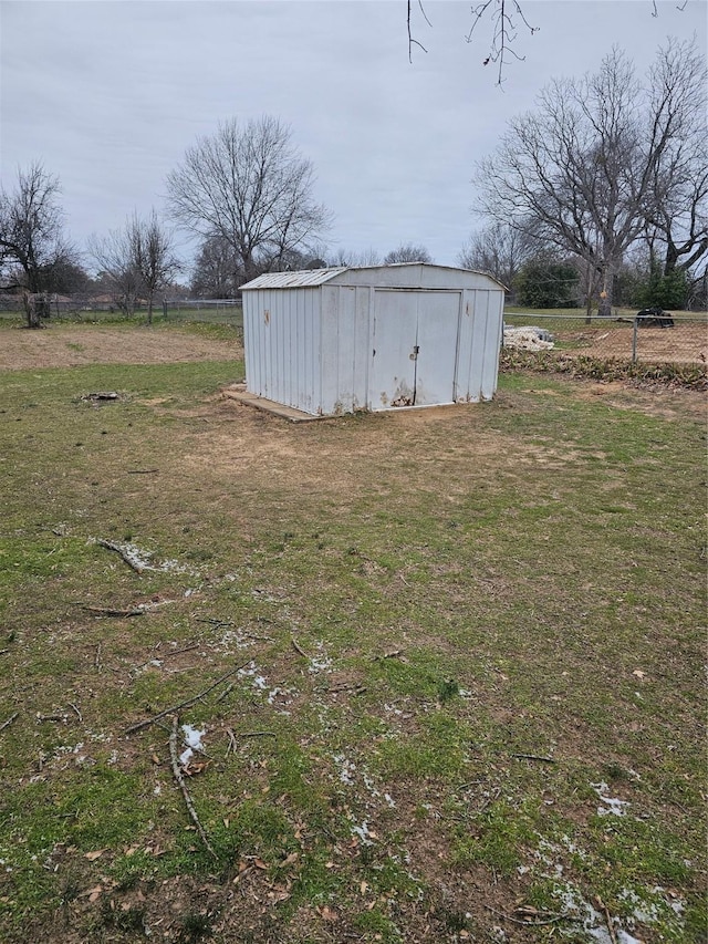 view of shed with a rural view