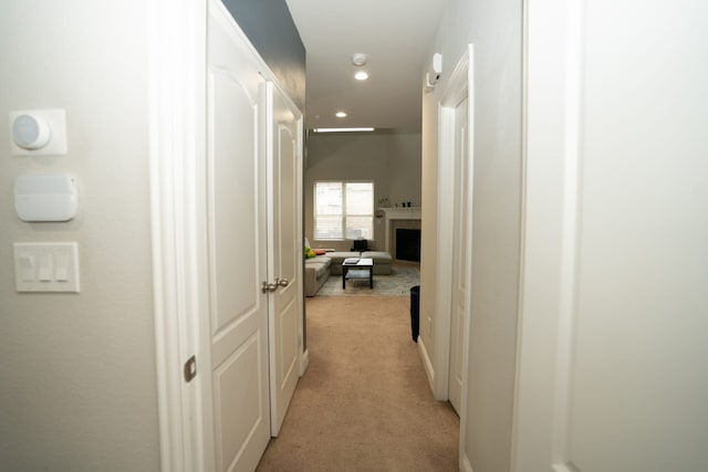 corridor featuring recessed lighting and light carpet