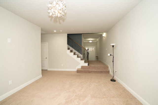 interior space featuring carpet flooring and baseboards