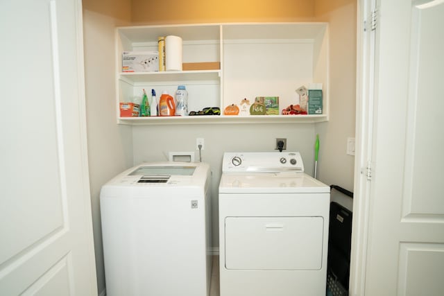 laundry area featuring laundry area and washing machine and clothes dryer