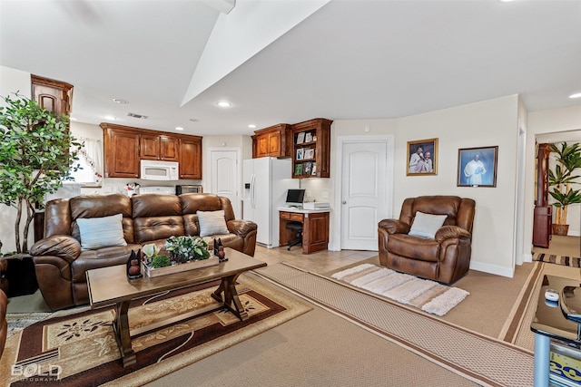 living area featuring visible vents, baseboards, recessed lighting, built in desk, and light carpet