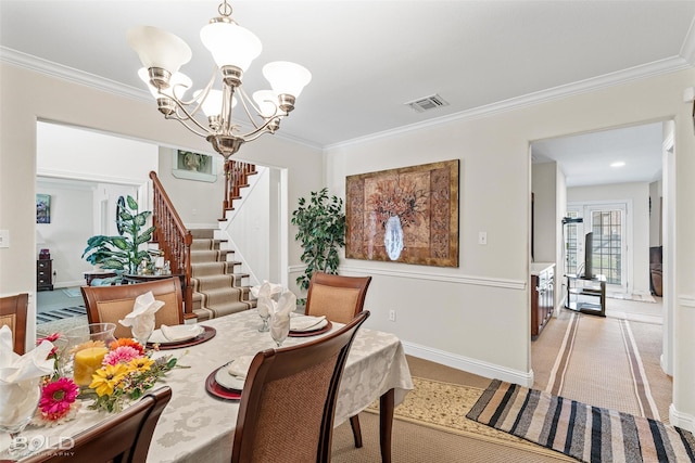 dining area featuring visible vents, stairway, crown molding, and an inviting chandelier