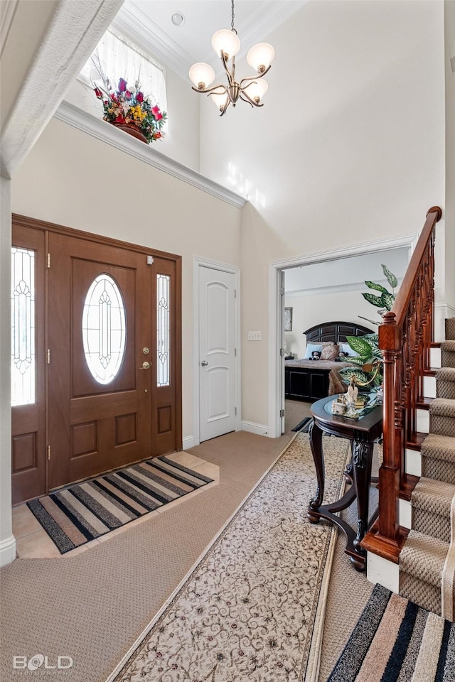 foyer featuring crown molding, a chandelier, stairway, light carpet, and a high ceiling