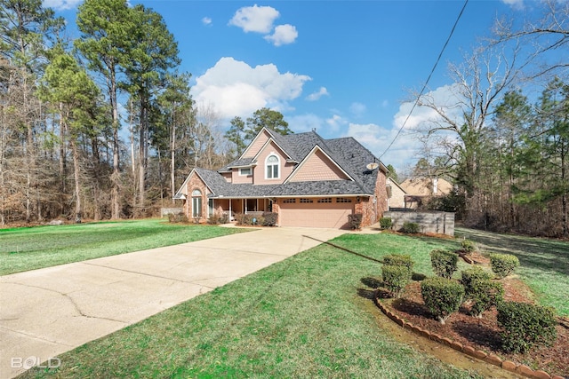 view of front of property featuring concrete driveway, a garage, a front yard, and a shingled roof