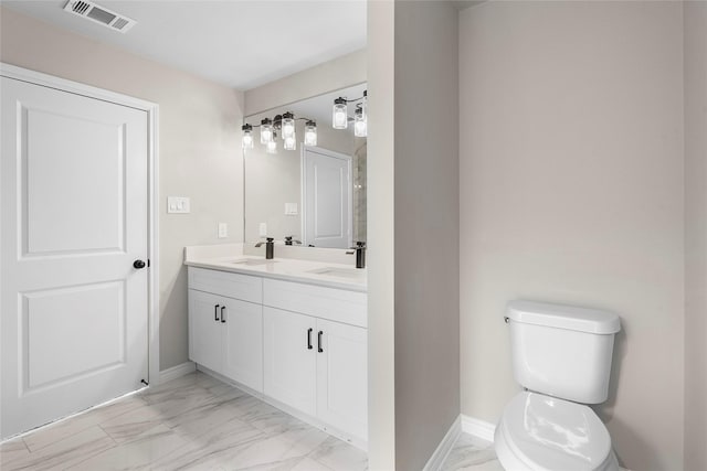 full bath featuring marble finish floor, a sink, visible vents, and baseboards