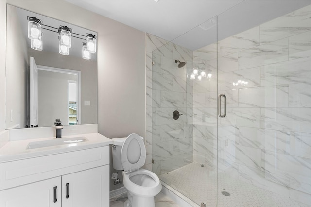 full bathroom featuring toilet, a stall shower, marble finish floor, and vanity