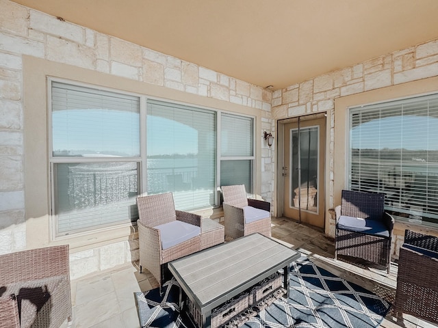 view of patio / terrace with heating unit and an outdoor hangout area