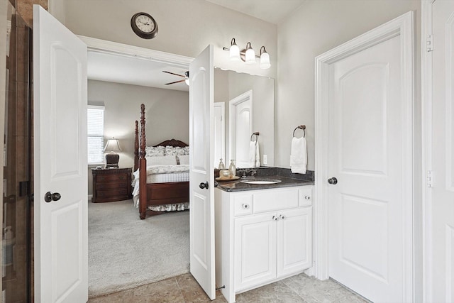 bathroom with vanity, a ceiling fan, and ensuite bathroom